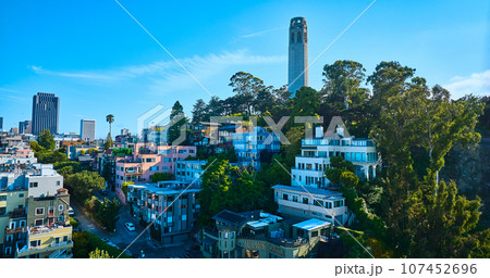 Aerial apartment buildings on Telegraph Hill with Coit Tower on sunny summer day 107452696