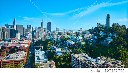 Aerial buildings and road leading to heart of downtown San Francisco and Coit Tower on hill Aerial buildings and road leading to heart of downtown San Francisco and Coit Tower on hill 107452702
