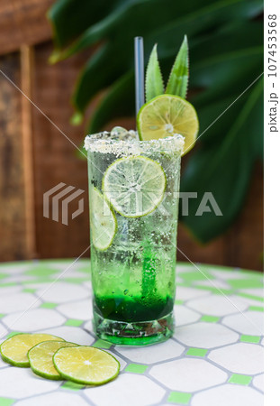 Panda leaves lemonade with desiccated coconut and green syrup on light gray background with copy space Panda leaves lemonade with desiccated coconut and green syrup on light gray background with copy space 107453568