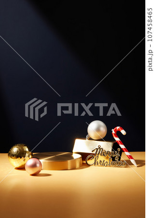Round-shaped golden podium decorated with baubles. Empty space on the podium to show goods or product. Different types of decorations developed across the Christian world Round-shaped golden podium decorated with baubles. Empty space on the podium to show goods or product. Different types of decorations developed across the Christian world 107458465
