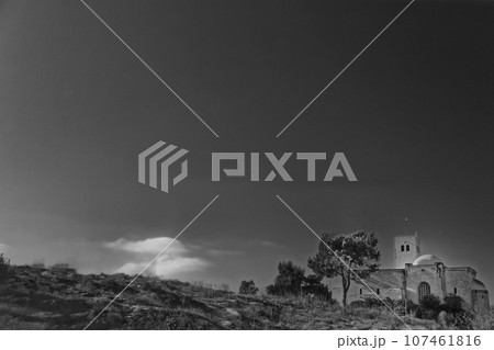 The historic Saint-Germain-l'Auxerrois Gothic style church in France, Black and white Paris cityscape with dramatic clouds The historic Saint-Germain-l'Auxerrois Gothic style church in France, Black and white Paris cityscape with dramatic clouds 107461816