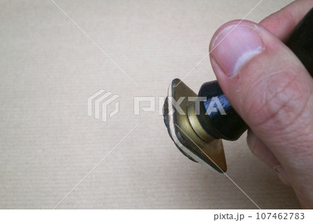 and going to stamp a paper with a rubber stamp and going to stamp a paper with a rubber stamp 107462783