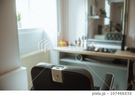 modern beauty salon with chairs and mirror 107466838