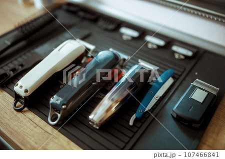 Closeup on hair clippers in modern beauty salon Closeup on hair clippers in modern beauty salon 107466841