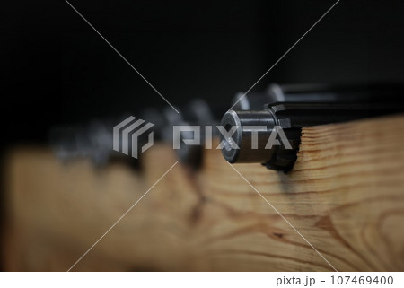 Industrial metal gear at factory. Prefabricated bearings of small diameter metal products and conveyor in production of gears Industrial metal gear at factory. Prefabricated bearings of small diameter metal products and conveyor in production of gears 107469400