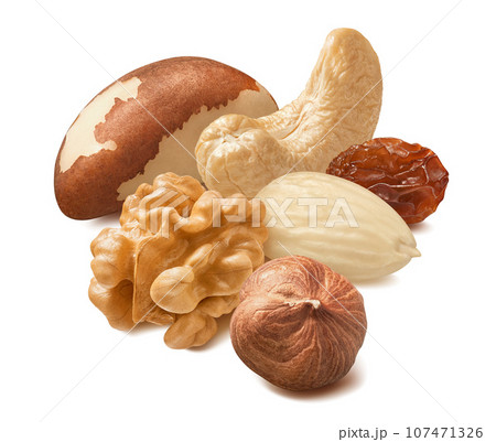Blanched almonds, hazelnuts, cashew, brazil nuts, walnuts and raisin isolated on white background Blanched almonds, hazelnuts, cashew, brazil nuts, walnuts and raisin isolated on white background 107471326