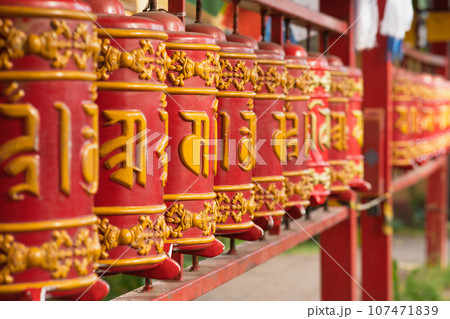 prayer wheels at the Datsan Gunzechoinei Buddhist temple prayer wheels at the Datsan Gunzechoinei Buddhist temple 107471839