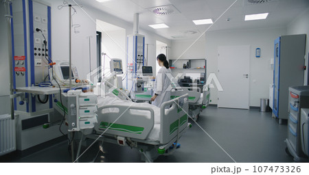 Elderly man in oxygen mask sleeps in bed after surgery in emergency room Elderly man in oxygen mask sleeps in bed after surgery in emergency room 107473326