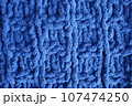 Dark blue handmade knitting blanket background. 107474250