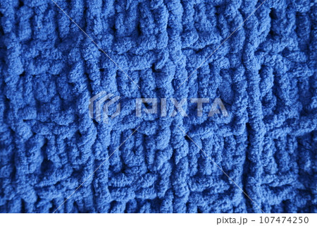 Dark blue handmade knitting blanket background. 107474250