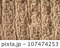 Yellow handmade knitting blanket background. 107474253