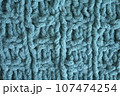 Light blue handmade knitting blanket background. 107474254