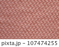 Light salmon pink handmade knitting blanket background. 107474255