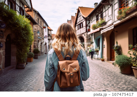 Exploring France's Charm Adventurous Blond Woman with Backpack Embraces Tourist Concept during Vacation. created with Generative AI 107475417
