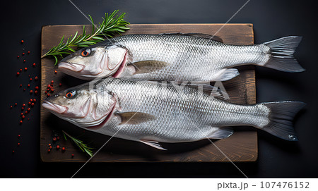 Exquisite Seabass Catch Freshness Defined on a Dramatic Black Canvas. created with Generative AI Exquisite Seabass Catch Freshness Defined on a Dramatic Black Canvas. created with Generative AI 107476152