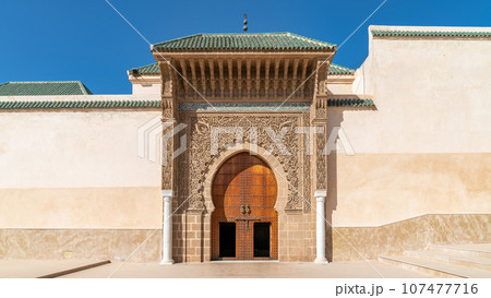 Traditional Moroccan door with Islamic design. Geometric shapes and floral motifs are common, with a piece of culture and history. Traditional Moroccan door with Islamic design. Geometric shapes and floral motifs are common, with a piece of culture and history. 107477716
