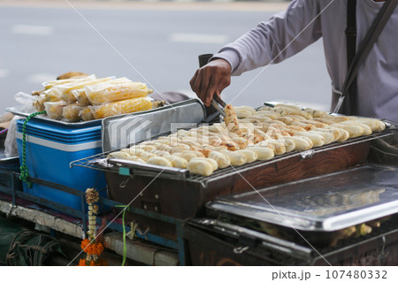 Grilled bananas are sold and prepared on the streets Grilled bananas are sold and prepared on the streets 107480332
