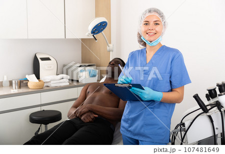 Young female doctor cosmetologist meeting client in aesthetic clinic 107481649