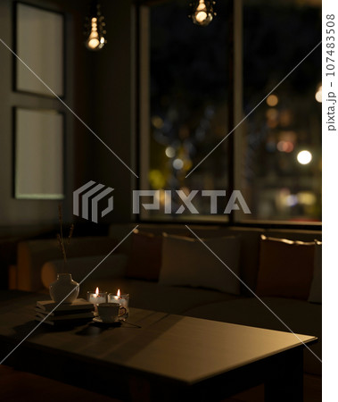 Close-up image of a hardwood coffee table in a modern dark living room at night. 107483508