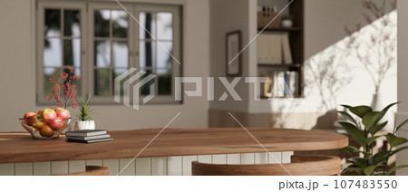 Copy space on a wooden kitchen island or countertop in a modern minimalist kitchen. Copy space on a wooden kitchen island or countertop in a modern minimalist kitchen. 107483550