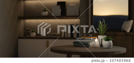 Close-up image of a table in a modern contemporary room in the evening. 107483968
