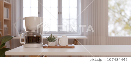 White minimal coffee table with coffee machine and coffee cup on the table. 107484445