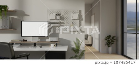 Modern minimal white home workspace with a computer on a table 107485417