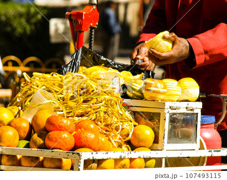 Detailed view of orange juice street vendor in Potosi, Bolivia 107493115