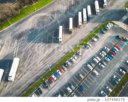 Aerial view of two parking lots, one for trucks and one for cars Aerial view of two parking lots, one for trucks and one for cars 107498170
