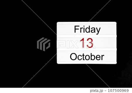 Friday 13th October text on white lightbox sitting. Composition with copy space. Friday 13th October text on white lightbox sitting. Composition with copy space. 107500969