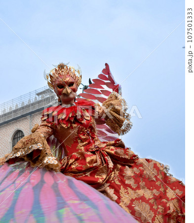 Person dressed up for Carnival of Venice wearing Fenix costume Person dressed up for Carnival of Venice wearing Fenix costume 107501333