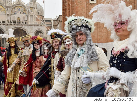 men and women dressed up at Venice carnival with authentic contemporary costumes men and women dressed up at Venice carnival with authentic contemporary costumes 107501400