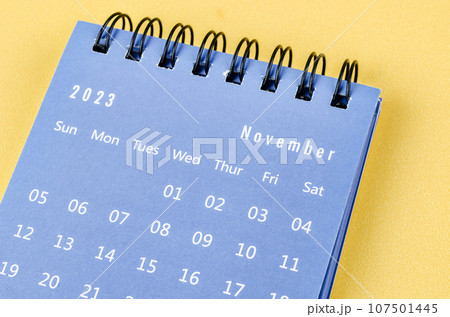 The November 2023 Monthly desk calendar for 2023 year on yellow background. 107501445