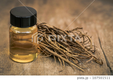 Dry leaves of medicinal cannabis with extract oil in a bottle Dry leaves of medicinal cannabis with extract oil in a bottle 107501511