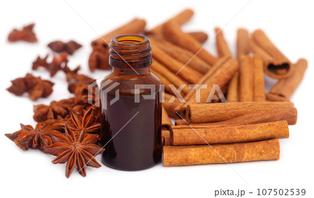 Some aromatic cinnamon with star anise and essential oil Some aromatic cinnamon with star anise and essential oil 107502539