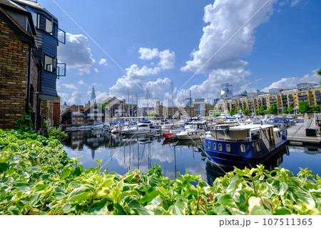 Leisure yachts and boats moored at St Katharine docks in London, United Kingdom Leisure yachts and boats moored at St Katharine docks in London, United Kingdom 107511365