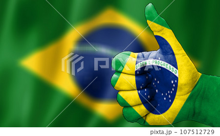 thumbs up in approval with the brazilian flag painted, 107512729