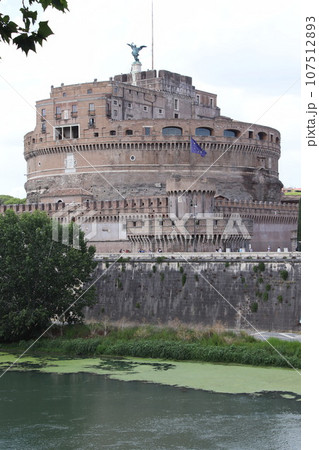 Castel Sant\'Angelo and old bridge, Rome, Italy. View of medieval Castle Sant\'Angelo, sky and Tiber River in summer. Scenery of famous Roman monument, landmark of Roma city. 107512893
