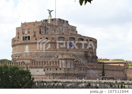 Castel Sant\'Angelo and old bridge, Rome, Italy. View of medieval Castle Sant\'Angelo, sky and Tiber River in summer. Scenery of famous Roman monument, landmark of Roma city. 107512894