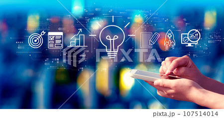 Great idea for success concept with person using a smartphone at night 107514014