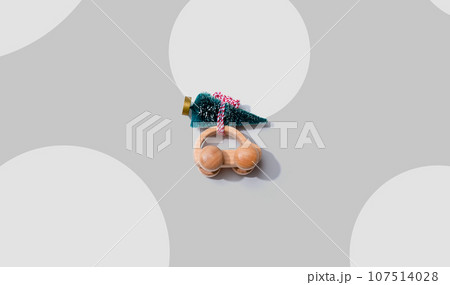 Wooden toy car carrying Christmas tree 107514028