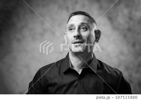 black and white portrait of a man in a shirt 107515800