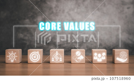 Core values concept, Wooden block on desk with core values icon on virtual screen. 107518960