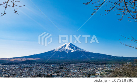 Mount Fuji, A landscape of tallest volcano mountain (Mt.Fuji) and Fujiyoshida City in Japan, view from Chureito Pagoda for background. 107519890