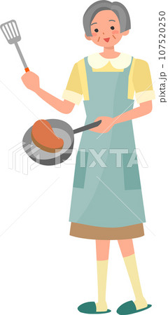 料理をする笑顔のシニア女性 料理をする笑顔のシニア女性 107520250
