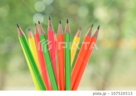 group of colourful sharp pencil on blur green nature background with bokeh group of colourful sharp pencil on blur green nature background with bokeh 107520513