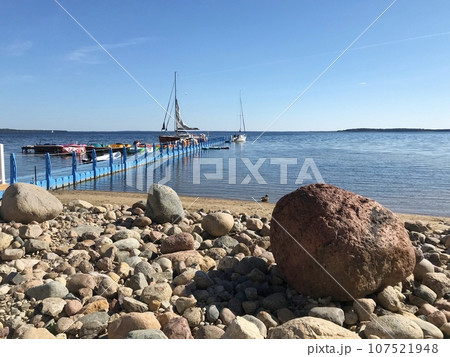 Boats moored on the lake. Lake Naroch. Boats moored on the lake. Lake Naroch. 107521948