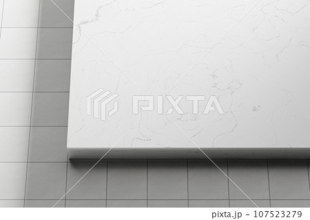 Simple black and white marble background with light streaming in. 107523279