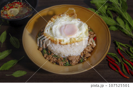Minced pork with basil over rice is a Thai food that is popular among Thai people Minced pork with basil over rice is a Thai food that is popular among Thai people 107525501