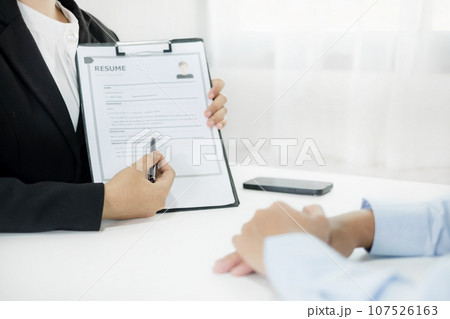 Business people hold a resume and talk to job applicants for job interviews about careers and Their personal history in the company. Recruitment concepts 107526163